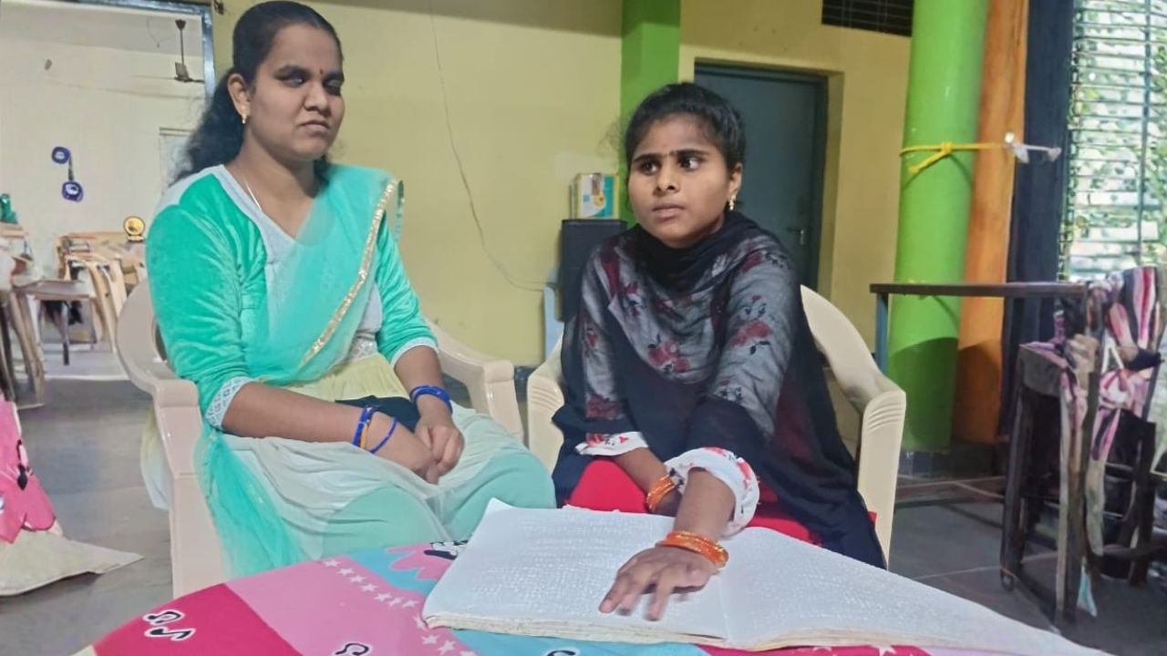 Students reading Braille Books